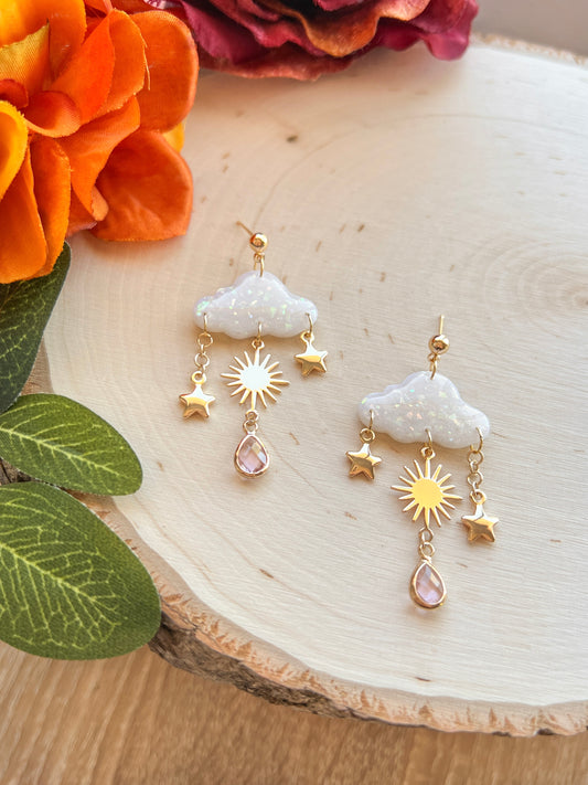 Handmade polymer clay earrings with flowing opal cloud design