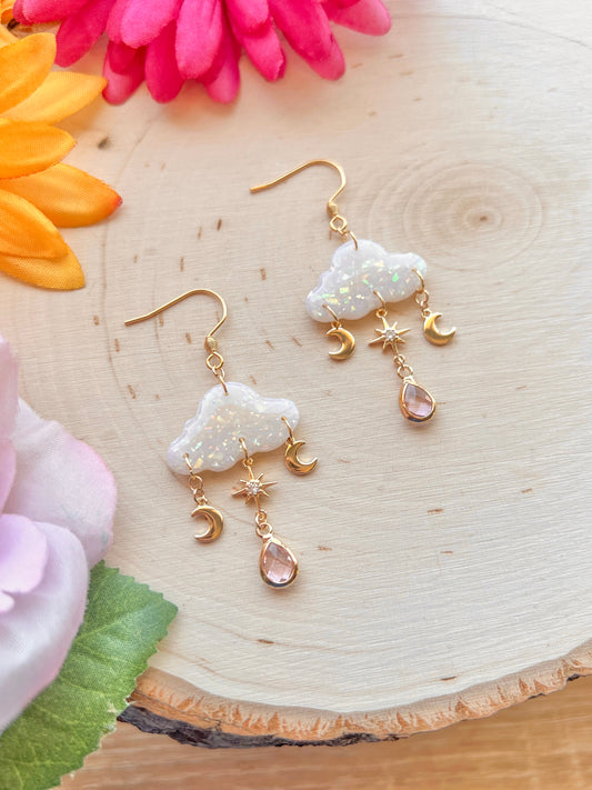 Handmade polymer clay opal cloud earrings with dangling moons, celestial design, lightweight and durable, made to order.