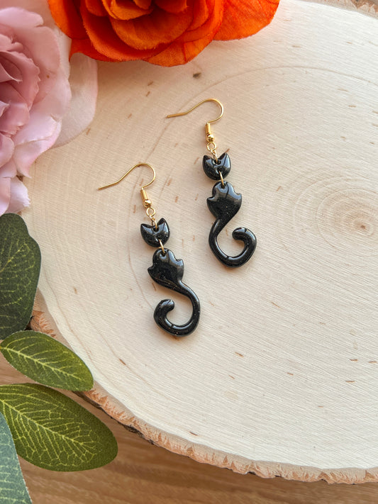 Handmade abstract black cat earrings made from polymer clay