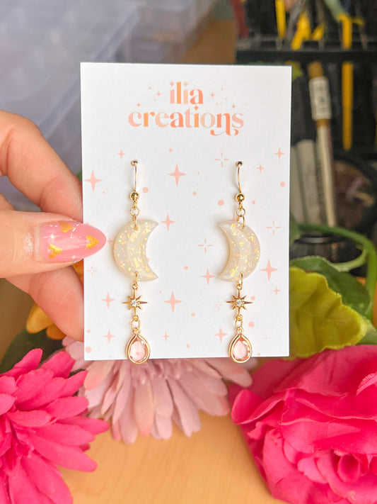 Handcrafted opal moon earrings with soft colorful glow, perfect for any occasion